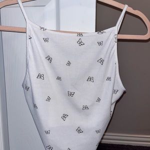 medium white crop top and black butterflies